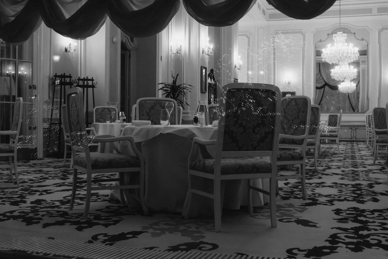 An elegant candlelit dining room set for a romantic anniversary dinner